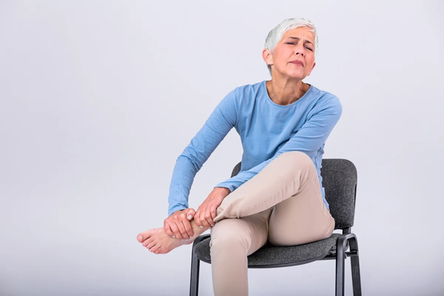 Woman experiencing foot discomfort